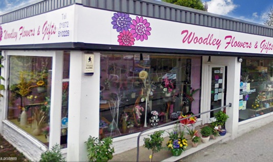 Woodley Flowers logo